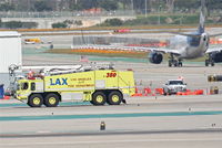  - Los Angeles City Fire Engine 380, on taxiway Charlie KLAX. - by Mark Kalfas