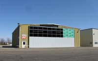  - Construction on a new hangar door. - by Kreg Anderson