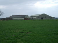  - The remaining two former F Type sheds used for agricultural purposes.  Located on the former RAF Station Pembrey airfield technical site. - by Roger Winser