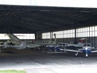  - Looking inside a hangar at St. Gallen-Altenrhein airfield, seen from the back side - by Ingo Warnecke
