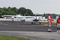  - Line of planes waiting to depart Lakeland during Sun N Fun 2010. - by Bob Simmermon