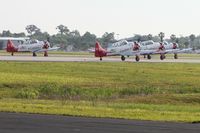  - Aeroshell Team AT-6's departing RWY 9. - by Bob Simmermon