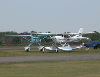  - VISITING CESSNA 206H N206MX AND RESIDENT CESSNA 182R G-ESSL TAXYING FOR DEPARTURE - by BIKE PILOT