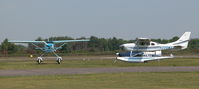  - VISITING CESSNA 206H N206MX AND RESIDENT CESSNA 182R G-ESSL  - by BIKE PILOT