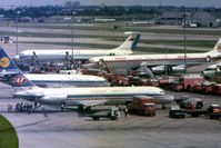  - A view from the Queens Building at Heathrow Airport including a Yugoslav Airlines DC-9, a Lufthansa Boeing 737, an Iberian McDonnell Douglas DC8, an Aeroflot Ilyushin I-62M, and a BOAC Comet 4.  - by Malcolm Clarke
