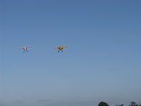 - N3G and N53EH on climb out departing the National Bucker Fly-In - by Doug Robertson
