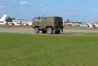  @ Zephyrhills Municipal Airport - Transient activity and a NATO personnel carrier during Sun N Fun week - by Bob Simmermon