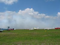 @ Zephyrhills Municipal Airport - Transient activity and someone laying down a little smoke during Sun N Fun week - by Bob Simmermon