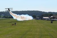  @ Beach City Airport - A little smoke show during Father's Day breakfast fly-in at Beach City, Ohio. - by Bob Simmermon