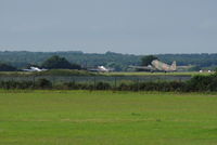  - Spitfire, Hurricane and Dakota parked on the far apron of Norwich Airport. - by Graham Reeve