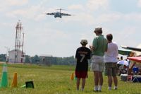  - Watching a C-17A (01-0192) arrive at Airventure 2010 - Oshkosh, Wisconsin - by Bob Simmermon