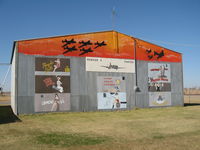  @ Enid Woodring Regional Airport - Hangar art at Enid - by Adserak