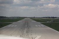  - Short final on Rwy 27 - by Timothy Aanerud