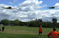  - A low T-6 flyover at the 4th annual Gerry Beck Memorial Fly-in at Battle Lake, MN. - by Kreg Anderson