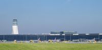  - Some NIKI-aircraft with tower and the Skylink-terminal behind. - by David Goetzl - DGpictures