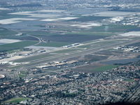  - Rwy 08-26 taken from RV-7 over city of Camarillo northeast of field looking southwest. Note greatly displaced threshold-Rwy 26. Oxnard eastern city limits at top of photo. Extensive farmland between the cities. - by Doug Robertson