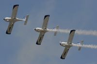  - Texan Team, three disabed pilots flying close formation in these ultra lights - taken at the Royal International Air Tattoo 2010 - by Steve Staunton