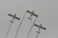  - Texan Team, three disabed pilots flying close formation in these ultra lights - taken at the Royal International Air Tattoo 2010 - by Steve Staunton