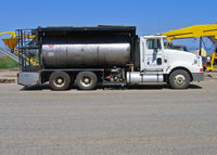  - Jones Flying Service Mother Truck awaits assignment with her crop dusters during rice planting season - by Steve Nation