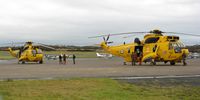  - Two RAF SAR helicopters on the apron after a rescue mission. From 202 and 22 Squadrons RAF. - by Roger Winser