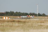  - Four Yak-52's preparing to depart Runway 22 for formation practice. - by Roger Winser