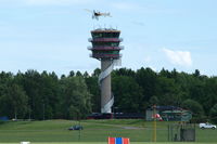  @ Malmen Air Base Airport - The tower of Malmen Air Base with the Thulin A (Bleriot XI) of Mikael Carlson flying above it during the 2010 Open Day. - by Henk van Capelle