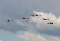  - T-6s in formation with a single BT-13 - by Florida Metal