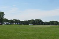  - A view down the ultralight strip at EAA AirVenture 2010. - by Kreg Anderson