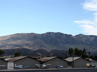  - Topa Topa Mountain Range above Santa Paula taken to left of adjacent Hines Peak photo. Sulphur Mountain at 2,727' elev. the nearer dark mass just above the Hangars. N66711 the biplane above in distance. (Look for the speck). - by Doug Robertson