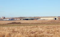  - General view towards the airport buildings and the two hangars. - by Roger Winser