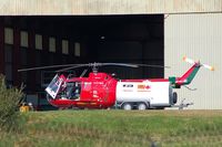  - Wales Air Ambulance helicopter at it's Swansea Airport Base  - by Roger Winser