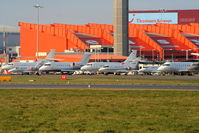  - Bizjets at Luton Airport amongst which are: A7-RZC Bombardier CL600, G-ODUR Hawker 800XP and G-THNX Cessna C525 Citation - by Chris Hall