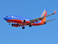  - Southwest Airlines / Looks like a running back - ball tucked in arm extended to push away a tackler. - by SkyNevada