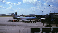  - Note the old Braniff International gates (BI). The building in the distance, just in front of the AA 727's #2 engine inlet, was at one time (the 1950's or so) the airline terminal.  - by GatewayN727