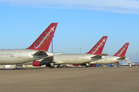  - Omni Air International 767's on the west ramp at DFW Airport - by Zane Adams