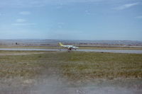  - N610MN (scarcely legible) taxies to runway 27R in June of 1981 at Billings Logan Airport. - by Daniel Ihde