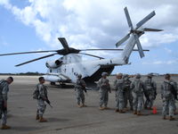  @ Kalaeloa (john Rodgers Field) Airport - Guam National Guard troops training for CH-53 Embark /Disembark training..JRF ramp on Naval Air Museum's CH-53. - by Ewa Marine