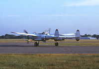  - Scanned from a dusty slide, I'm ninety percent certain this is N25Y. Photo is taken from the front yard of the North Hennipen Flying Club. Aircraft is in the run up area for rwy 23R.Tailboom says Confederate Air Force. - by GatewayN727