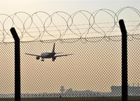  - View through the fence at rwy 08L (by the way: the view at rwy 08R isn´t much more different;) - by Holger Zengler