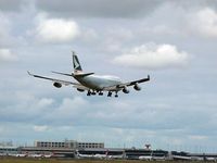  @ Melbourne International Airport - Cathay Pacific Cargo Boeing 747 B-HOU arriving runway 16 at Melbourne, over the International Terminal. The multi storey building is the airport hotel above the multi level short term car park. Qantas domestic terminal is on the left. - by red750