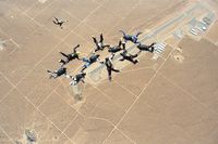  - Aerial view of the Apple Valley Airport.  Photo was taken 15 Nov 1998 of a 10-Way skydiving formation from when Apple Valley Skydive was still in operation back then. - by Greg Bishop