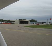  - View of the hangar where breakfast is being served. - by Kreg Anderson