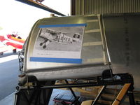 - Joe Krybus Bucker Shop-Jungmeister fuselage in build with photo preview of coming Jungmeister attraction. - by Doug Robertson