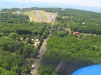  @ Put In Bay Airport - Turning final for 21 - by Bob Simmermon