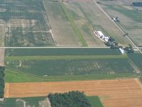 - Looking east at two uncharted farm strips on Co. Rc. 294 east of Vickery, Ohio.  N-S runway on this side of the road, E-W runway beyond. - by Bob Simmermon
