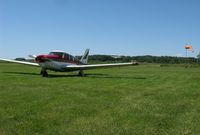  @ Starbuck Municipal Airport - A view of a Piper Commanche and the windsock at Starbuck Airport with a Cessna Skyhawk taking off in the background. - by Kreg Anderson