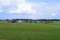  - Sixty helicopters at Turweston used for ferrying race fans to Silverstone for the British F1 Grand Prix - by Chris Hall