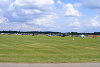  - Sixty helicopters at Turweston used for ferrying race fans to Silverstone for the British F1 Grand Prix - by Chris Hall