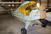  @ Parr Airport - Airport owner Chuck Norman showed us his Cub restoration while at the EAA fly-in. - by Bob Simmermon