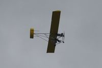  - Ultralight with a tube-shaped tail overflying Sun N Fun 2011.  It must be stable handling because it was too gusty for the air show! - by Bob Simmermon